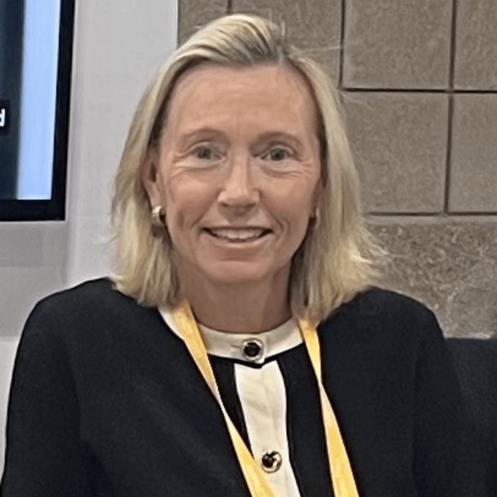 lady in black sweater with yellow landyard